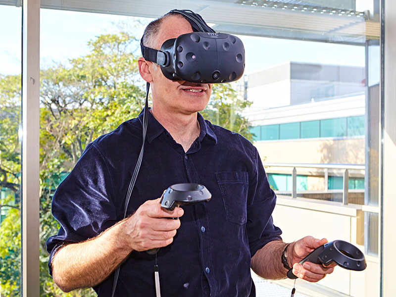 Professor Mike English testing the virtual reality gear. Credit PS:Unlimited Photography
